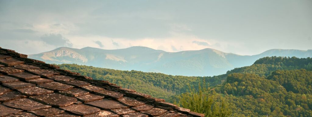 Karashka House at twilight, a restored 19th-century Balkan home where cultural heritage, nature, and contemporary creativity meet.